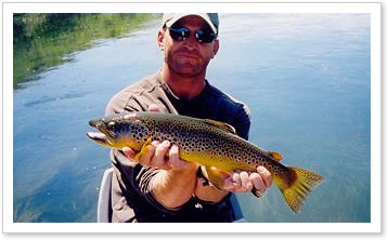 Angler with big Brown trout